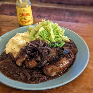 Herby sausage with cabbage and mashed potato