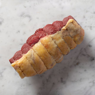 uncooked beef rump joint on white marble