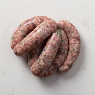 pack of  sausages on white marble