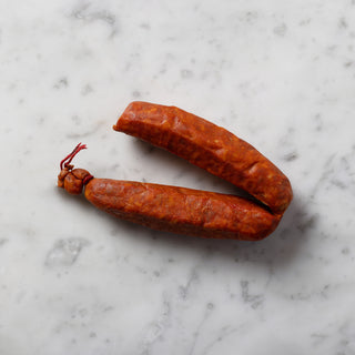 spanish chorizo sausage on white marble