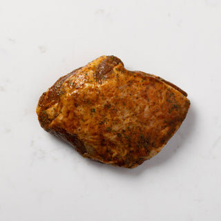 Moroccan marinated boneless lamb rump on a white background
