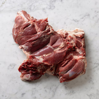 Butterflied leg of hogget on white marble