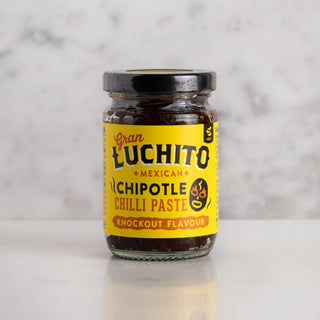 Jar of Luchito Chipotle Chilli paste on white marble