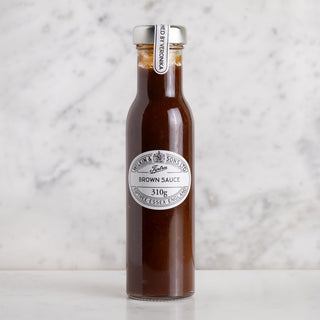 Glass bottle of Wilkin Brown Sauce on white marble